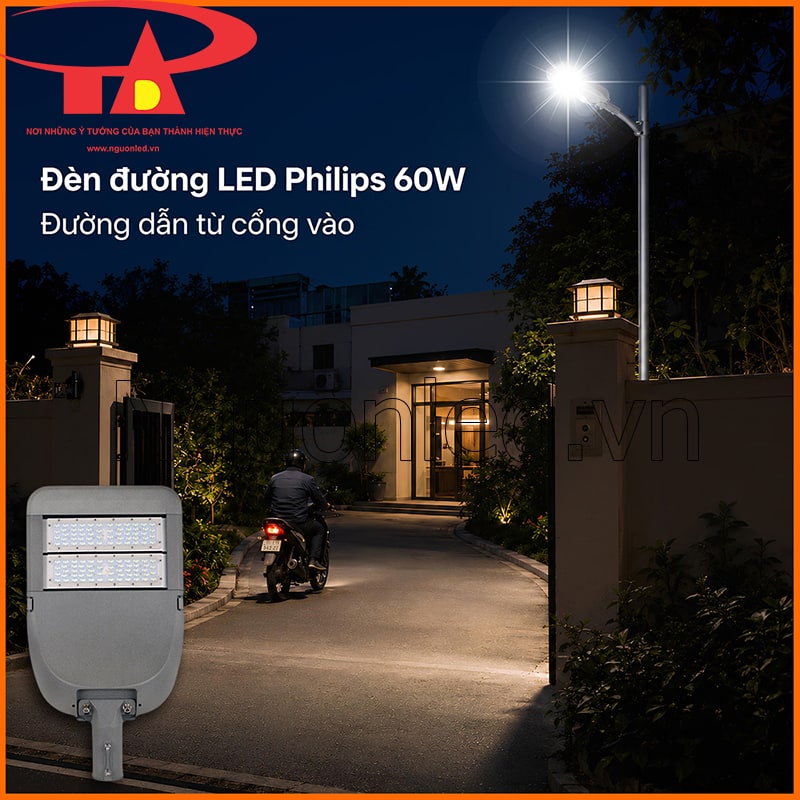 Đèn đường Philips 60W chiếu đoạn dẫn ngắn từ cổng vào khu nhà, làm rõ mép đường và điểm đổi hướng