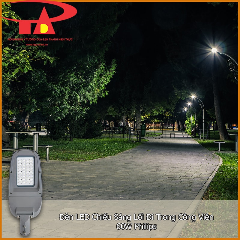Đèn LED chiếu sáng lối đi trong công viên 60W Philips với hàng cây, ghế nghỉ và mặt đường lát gạch